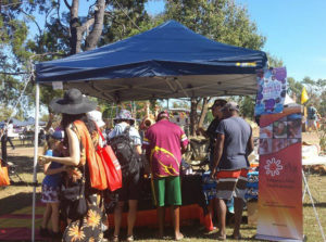 Festival goers gathering at the IAHA stall. 